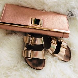 Pink clutch purse with gold linked strap